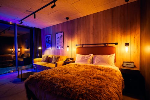 Illuminated Bedroom with a Fluffy Blanket
