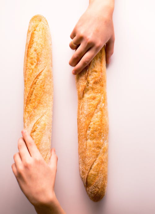 Free Persons Holding Bread Stock Photo