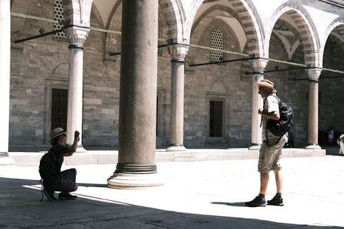 Tourists Taking Pictures on Mosque Courtyard