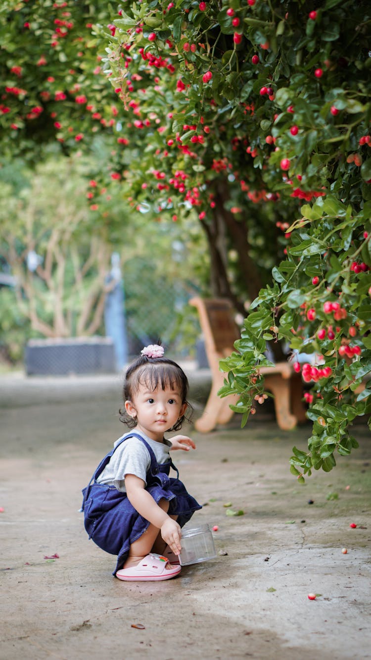 Little Girl In A Garden