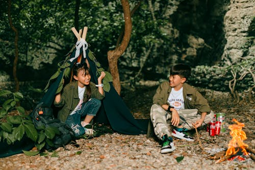 Teenagers at the Campsite in the Forest