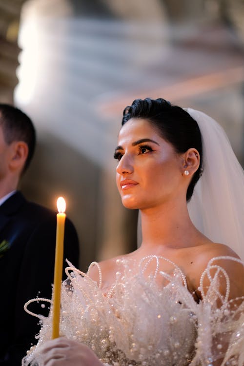 Brunette Bride with Wax Candle on Wedding