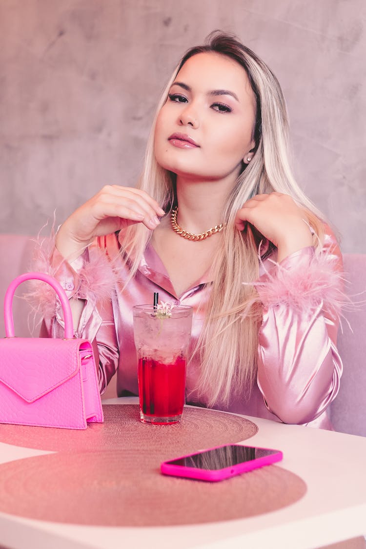 Blonde Woman Sitting With Cocktail