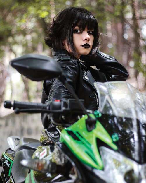 Woman in Leather Jacket with Motorbike