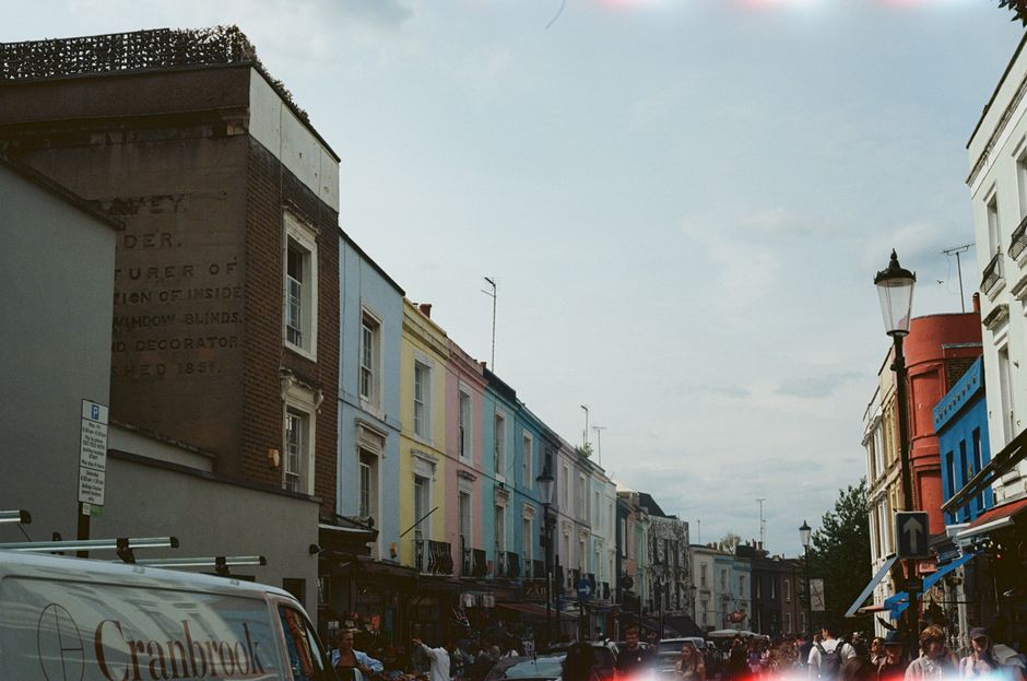 person walking through a vibrant city street with shops and cafes - Centrally located apartments person walking through a vibrant city street with shops and cafes - Centrally located apartments