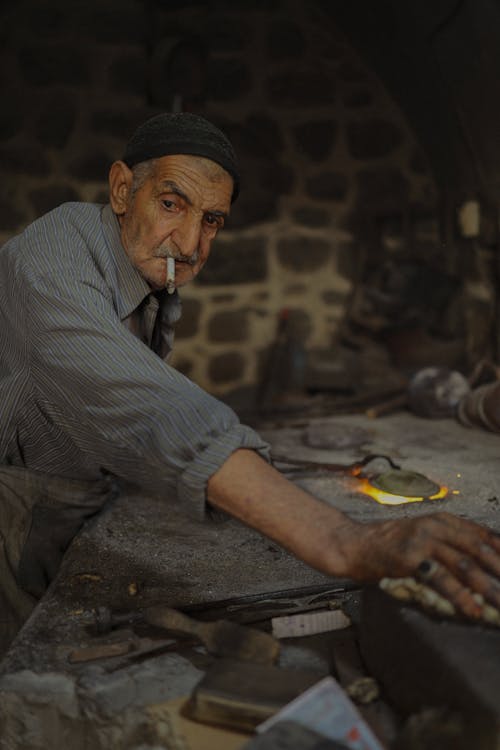 An Elderly Blacksmith at the Workshop