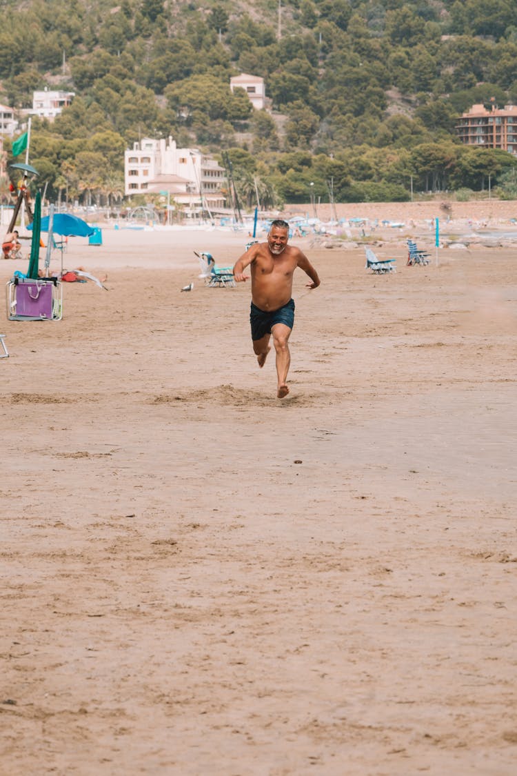 Man Running On The Beach