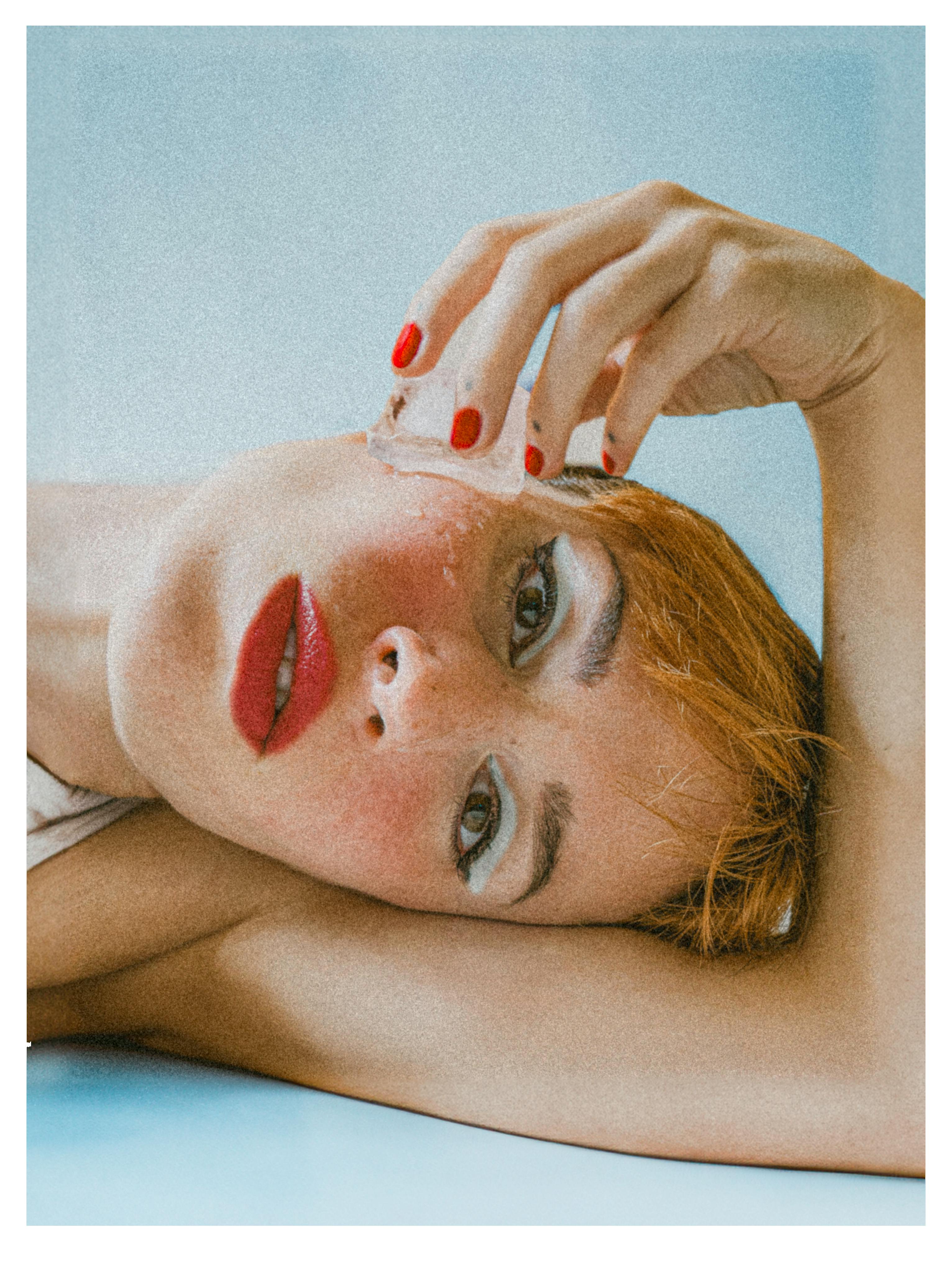 Creative portrait of a woman in a vintage style with ice and red accents.