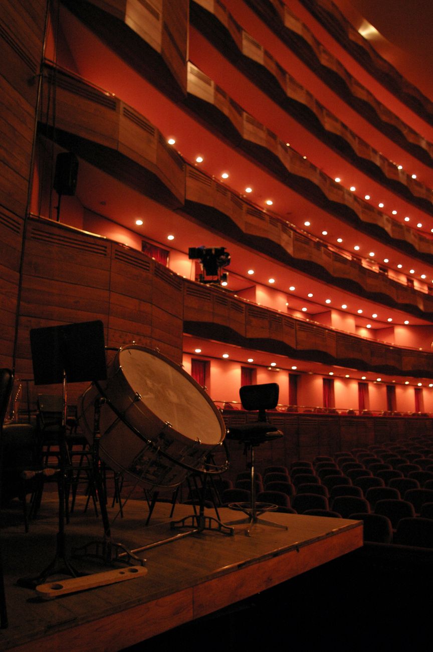 View of a grand auditorium stage in La Plata's opera house, featuring musical instruments.
