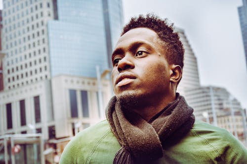 Selective Focus Photography Of Man Wearing Scarf