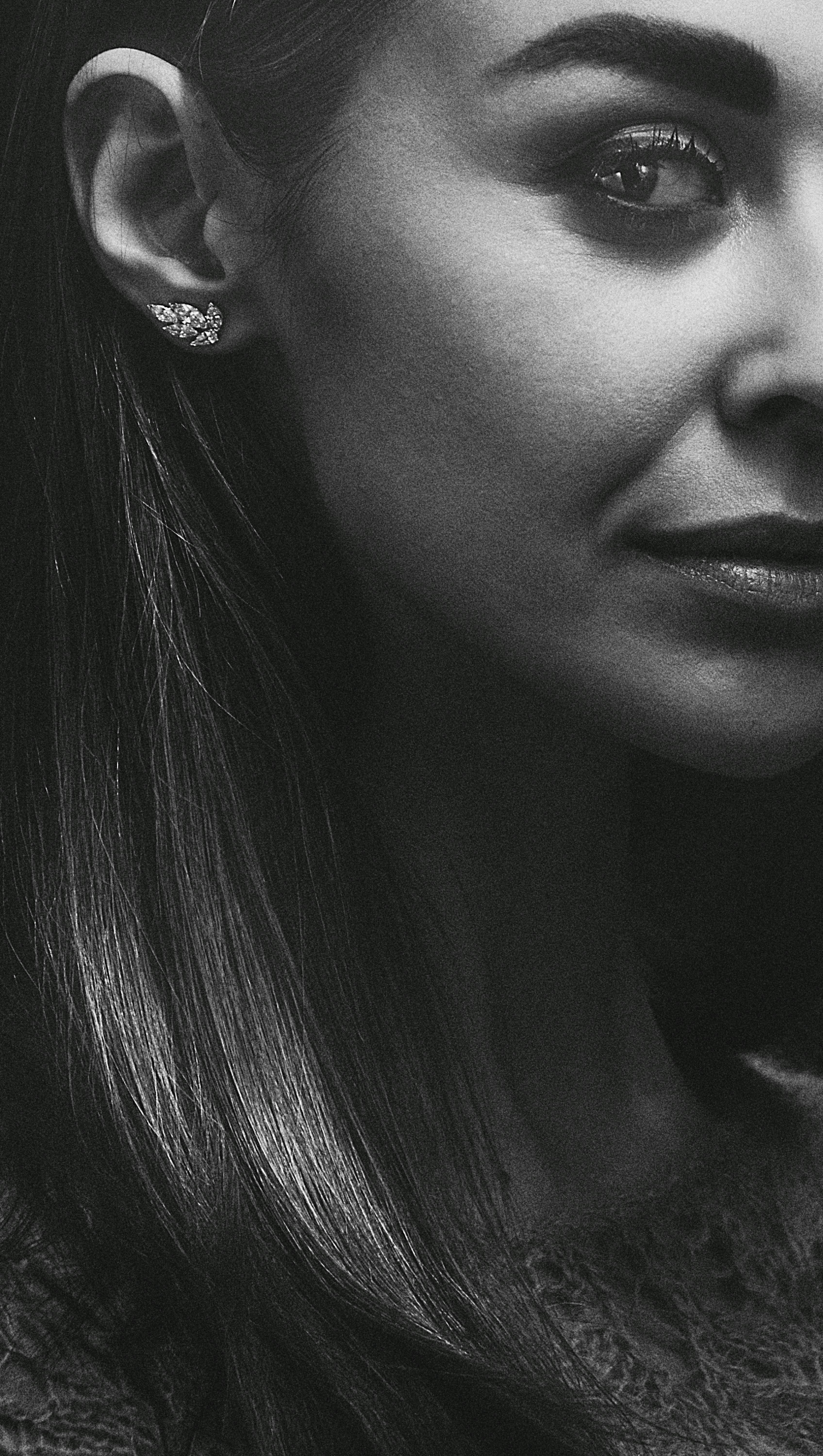 Free Close-up black and white portrait showcasing a woman's elegant features and jewelry. Stock Photo