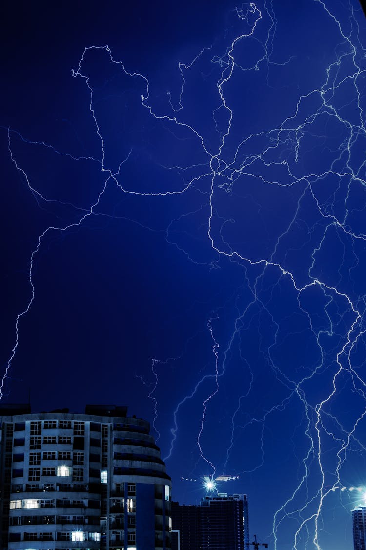 Lightnings On Sky Over Town At Night