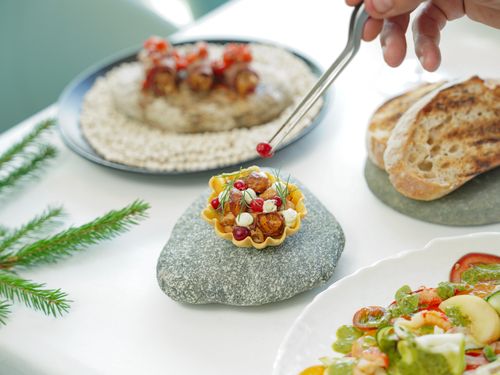 Free A chef carefully garnishes a gourmet dish with culinary precision and artistry. Stock Photo