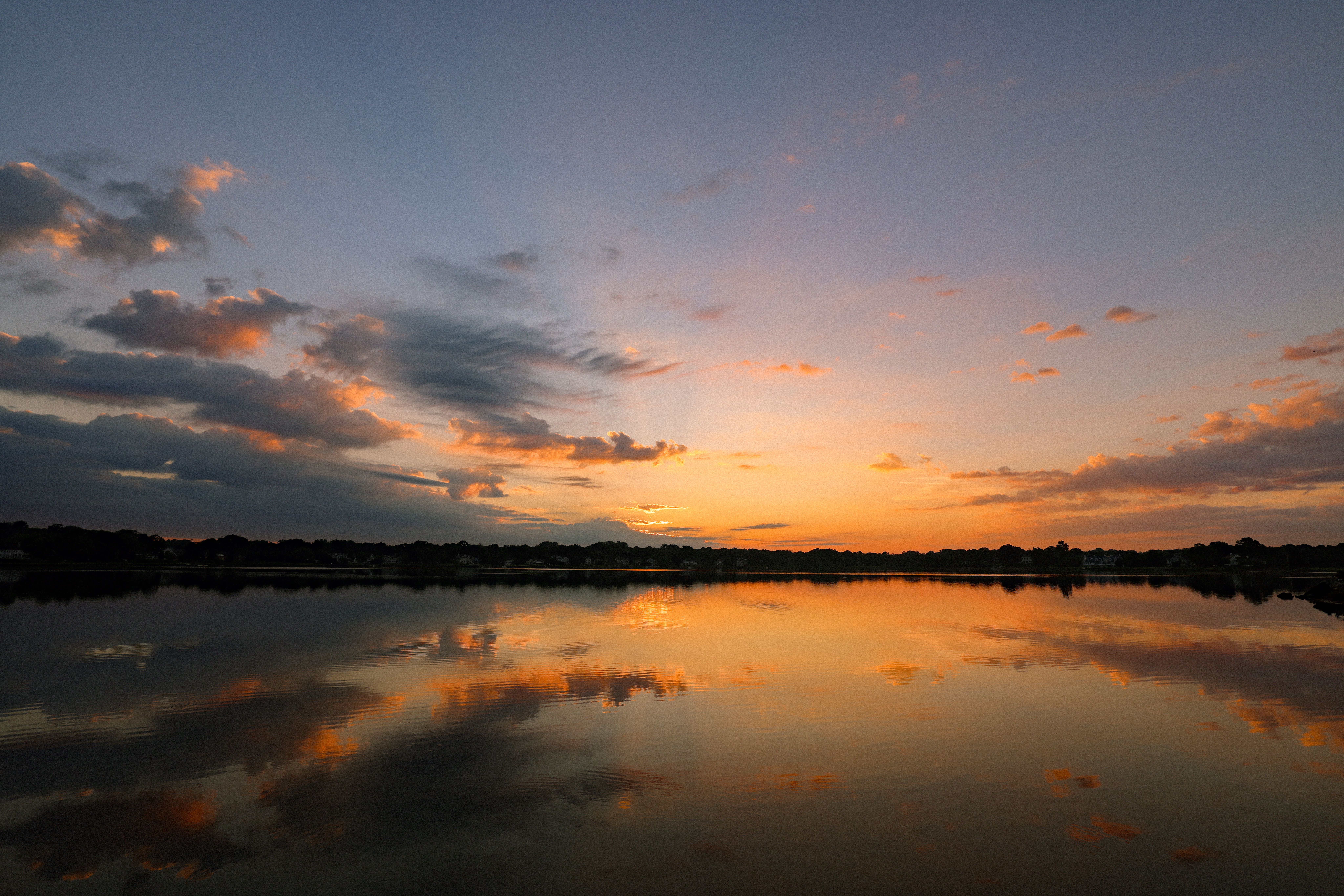 View of a Sunset Sky Reflecting in a Lake · Free Stock Photo
