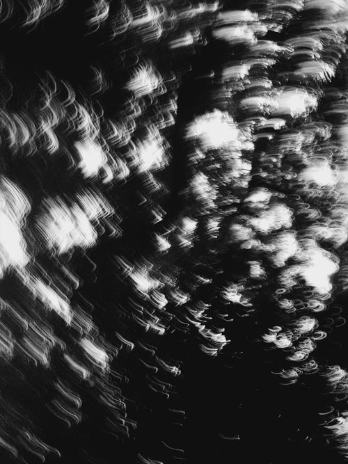 Free An abstract black and white image showcasing dynamic motion blur with swirling patterns and contrast. Stock Photo