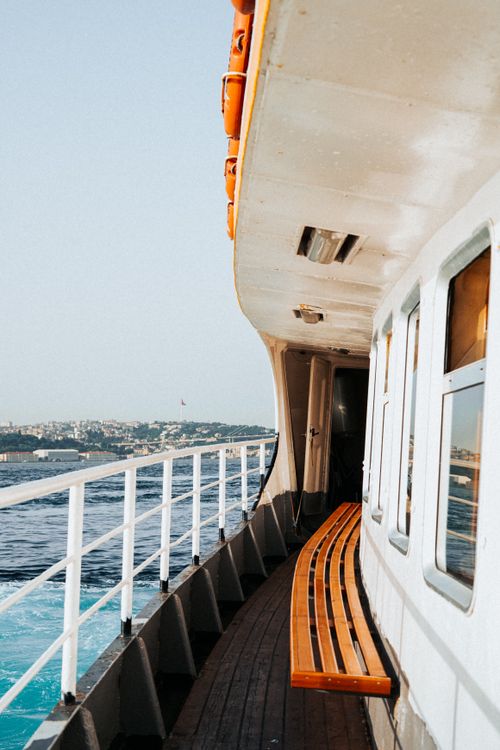 Free Experience the serene ride on a ferry across the Bosphorus with a cityscape view in Istanbul, Turkey. Stock Photo