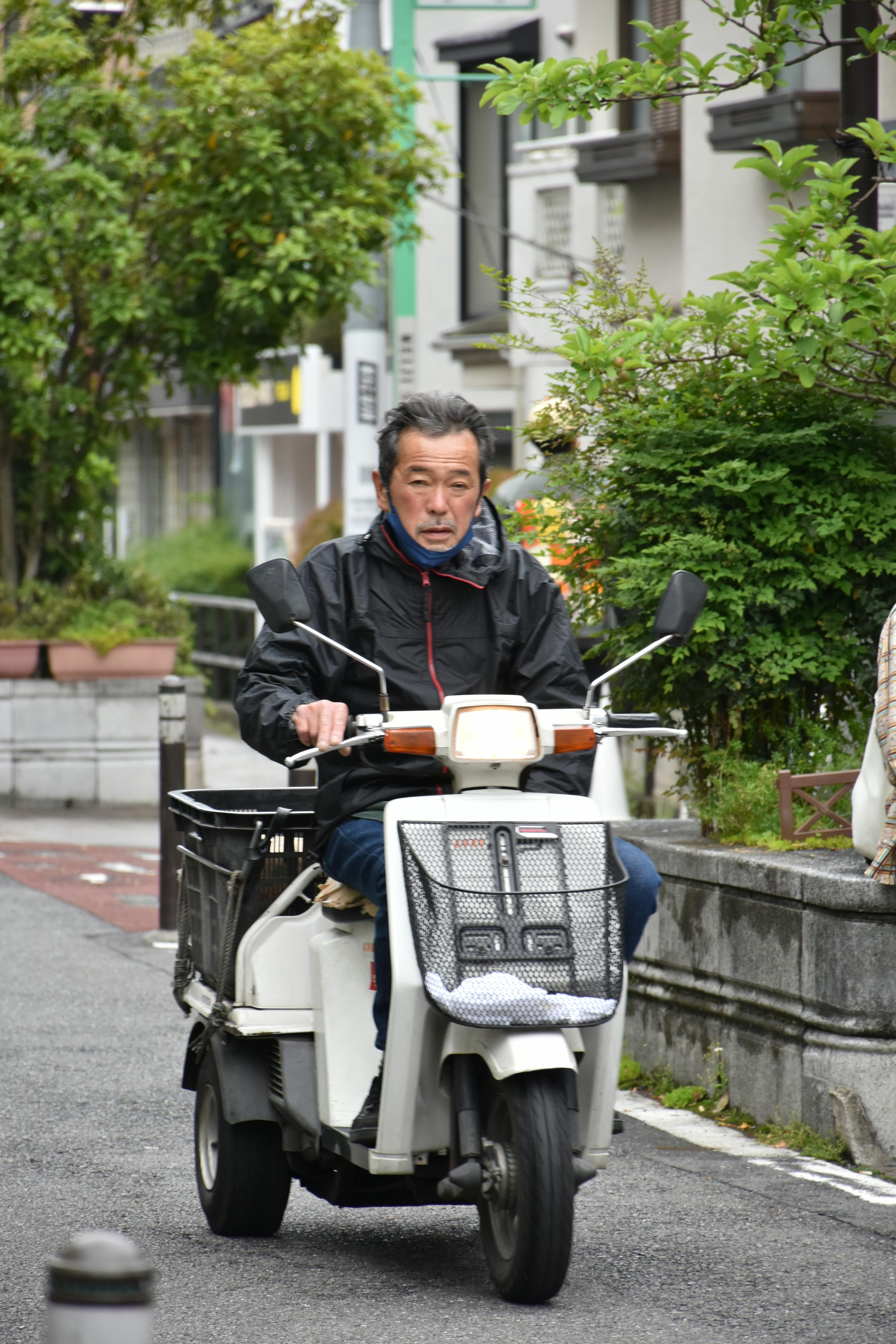 Senior using mobility scooter in modern senior living facility