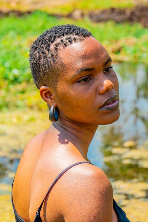 Young Woman with Short Hair Standing Outside 