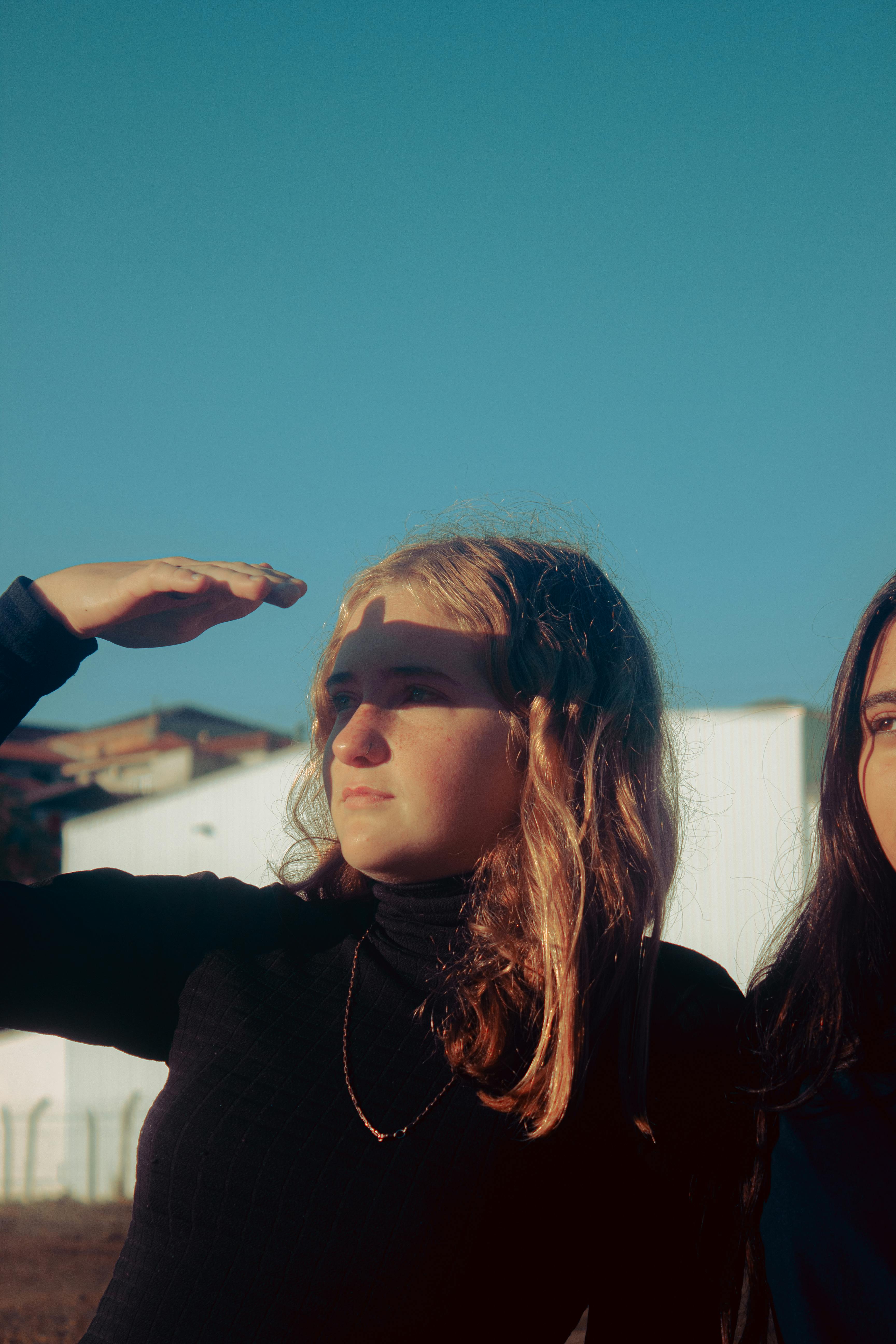 Blonde Young Woman Covering Eyes From Sun · Free Stock Photo