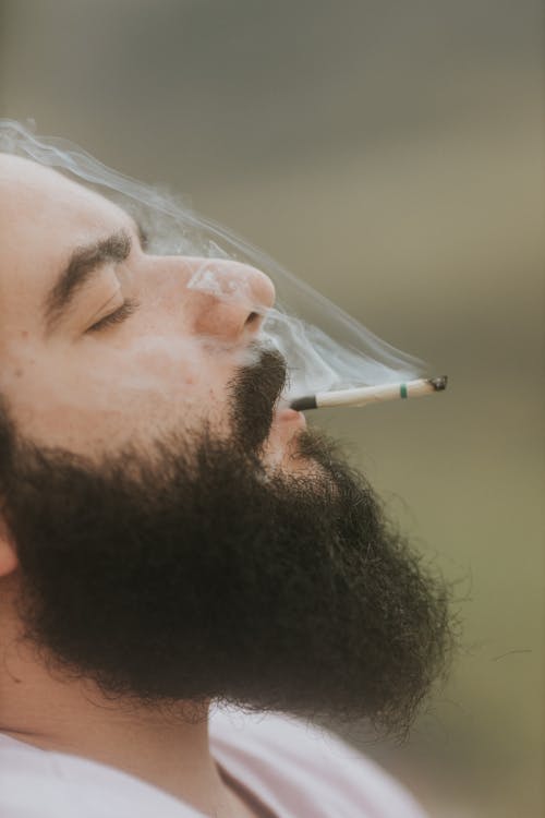 Man with Beard Smoking Cigarette