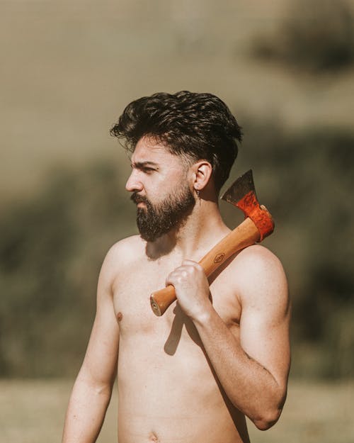 Shirtless Man Holding Axe