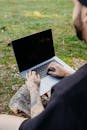 Man Holding Hands on Laptop