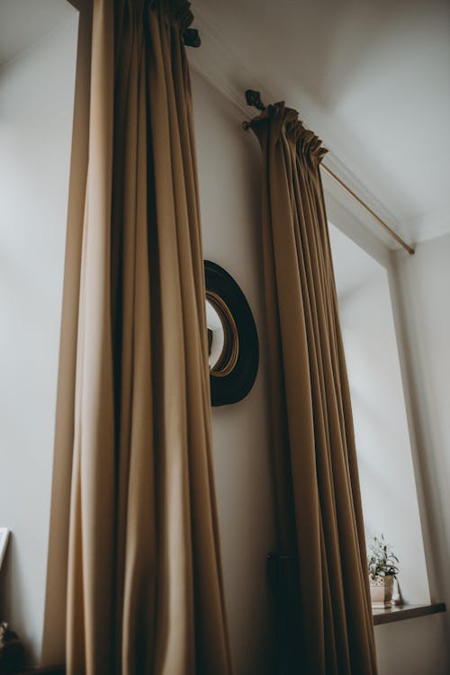 View of Brown Curtains Hanging in a Room 