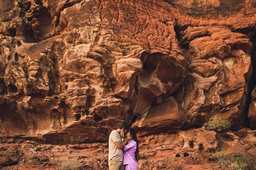 Couple Kissing in front of a Rock Formation