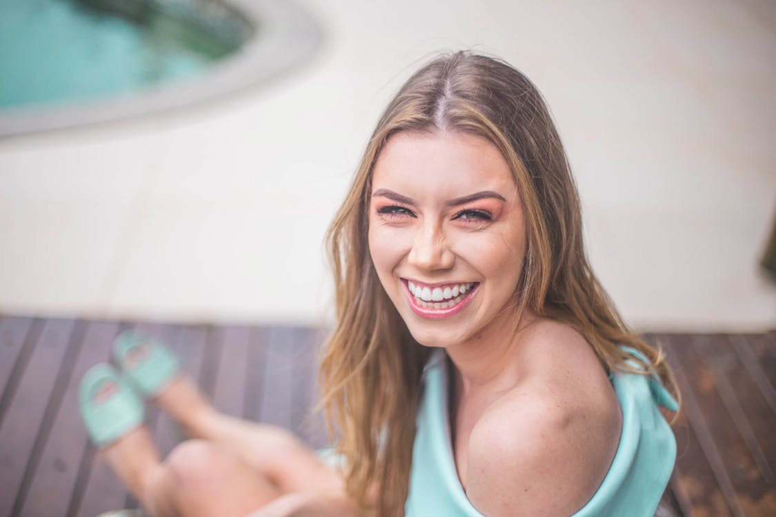 Woman Wearing Teal Off-shoulder Dress