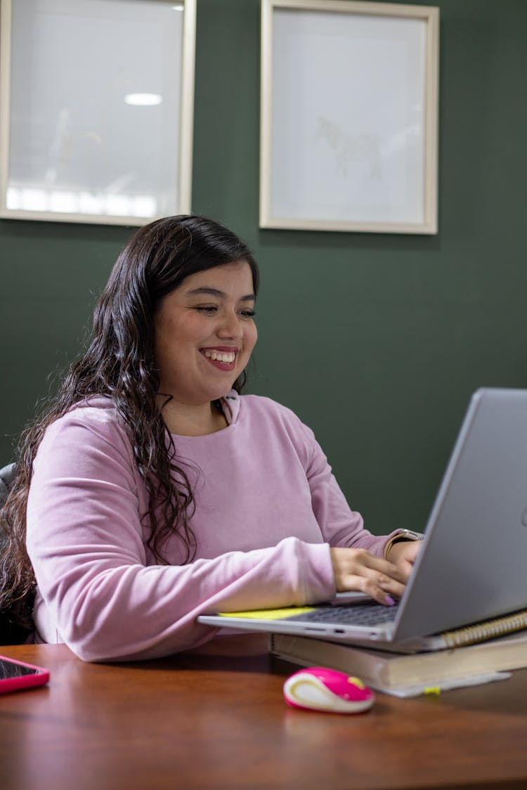 Woman Using A Laptop In An Office 