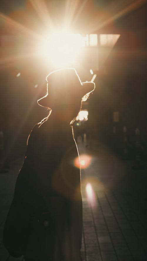Silhouette of Person in Hat