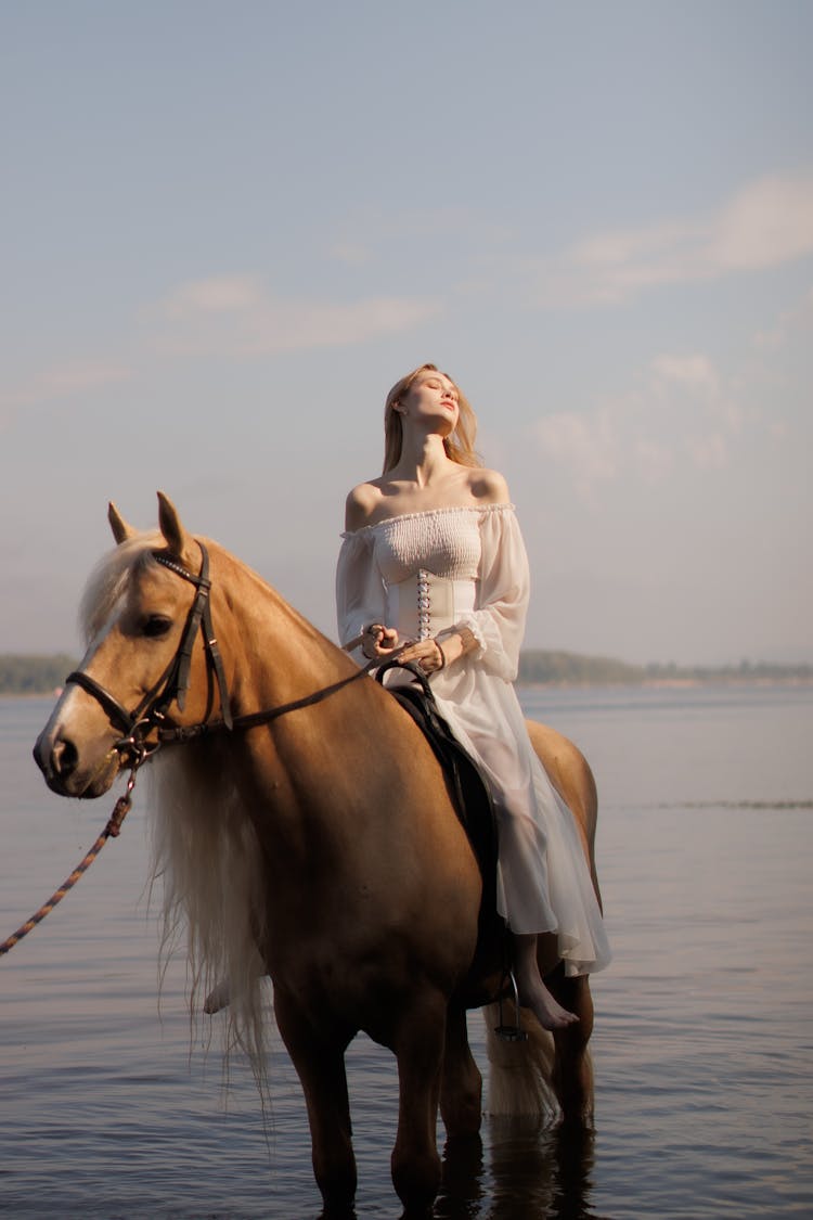 Woman On Horse In Lake