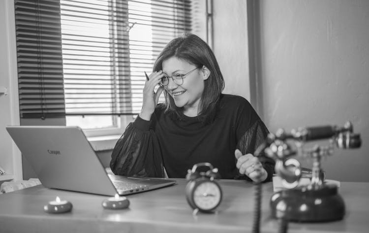 Woman Working On A Laptop In An Office