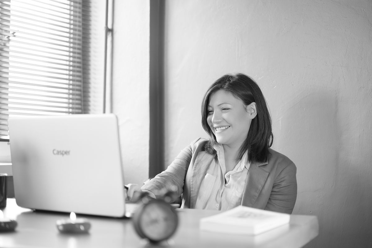 Smiling businesswoman working at her desk