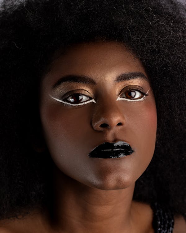 Portrait of a Pretty Brunette Wearing a Black Lipstick and an Eyeliner