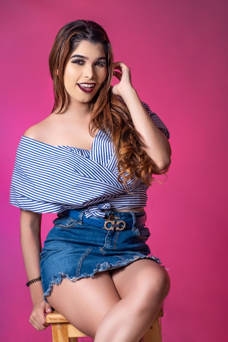 woman wearing denim mini skirt and off shoulder top