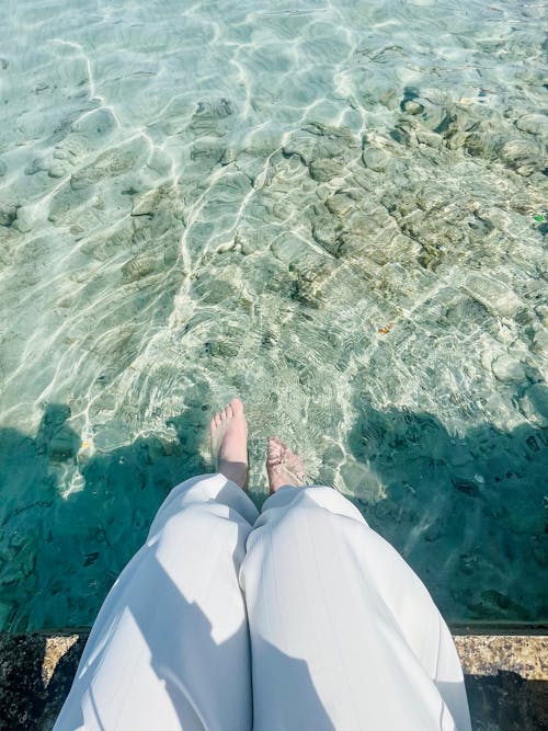 Free Human Legs in Water Stock Photo