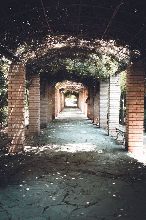 Free Peaceful brick archway with columns and shadows in Athens, Greece. Stock Photo