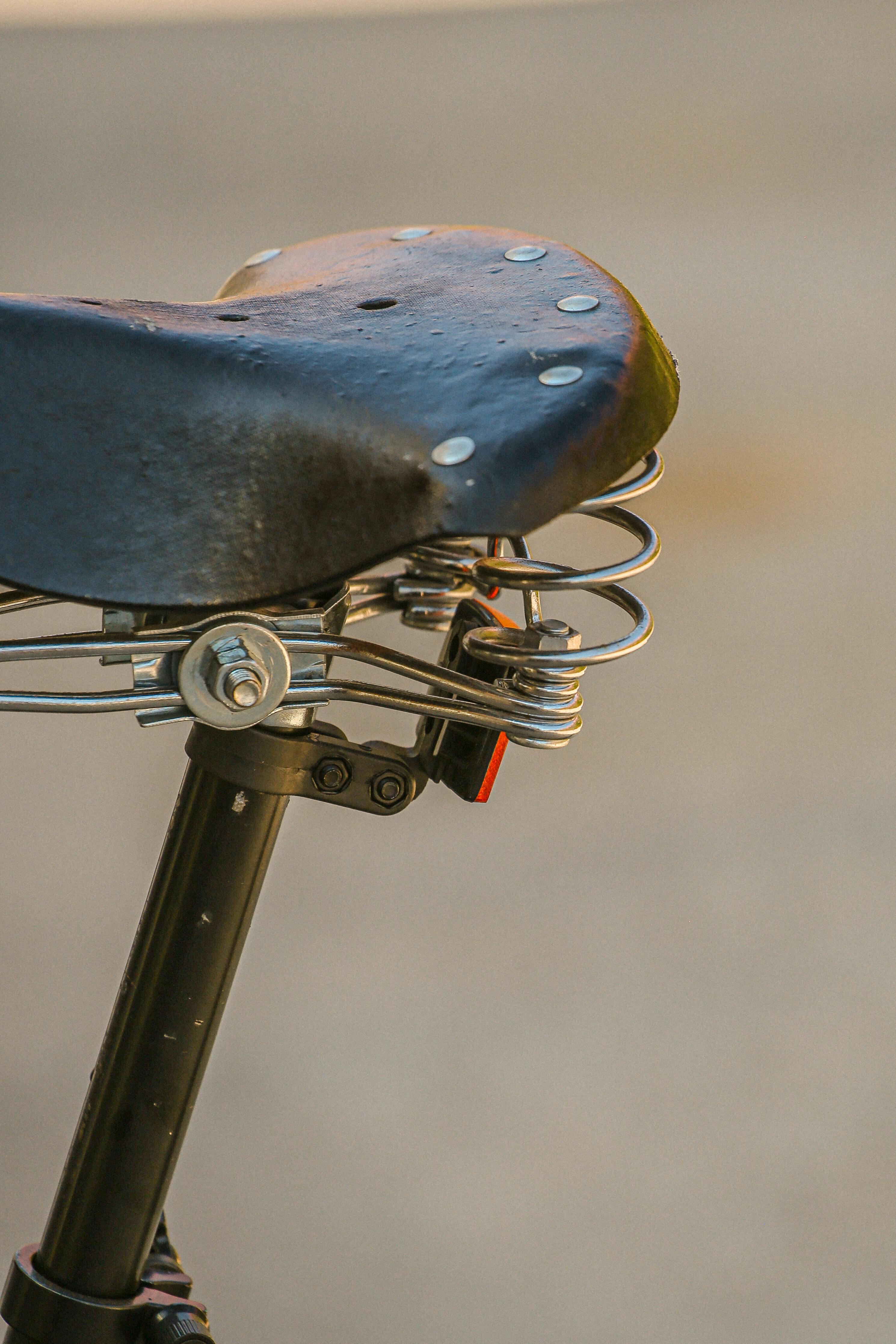 Close-up of an old bicycle seat with springs in Sardinia, Italy.