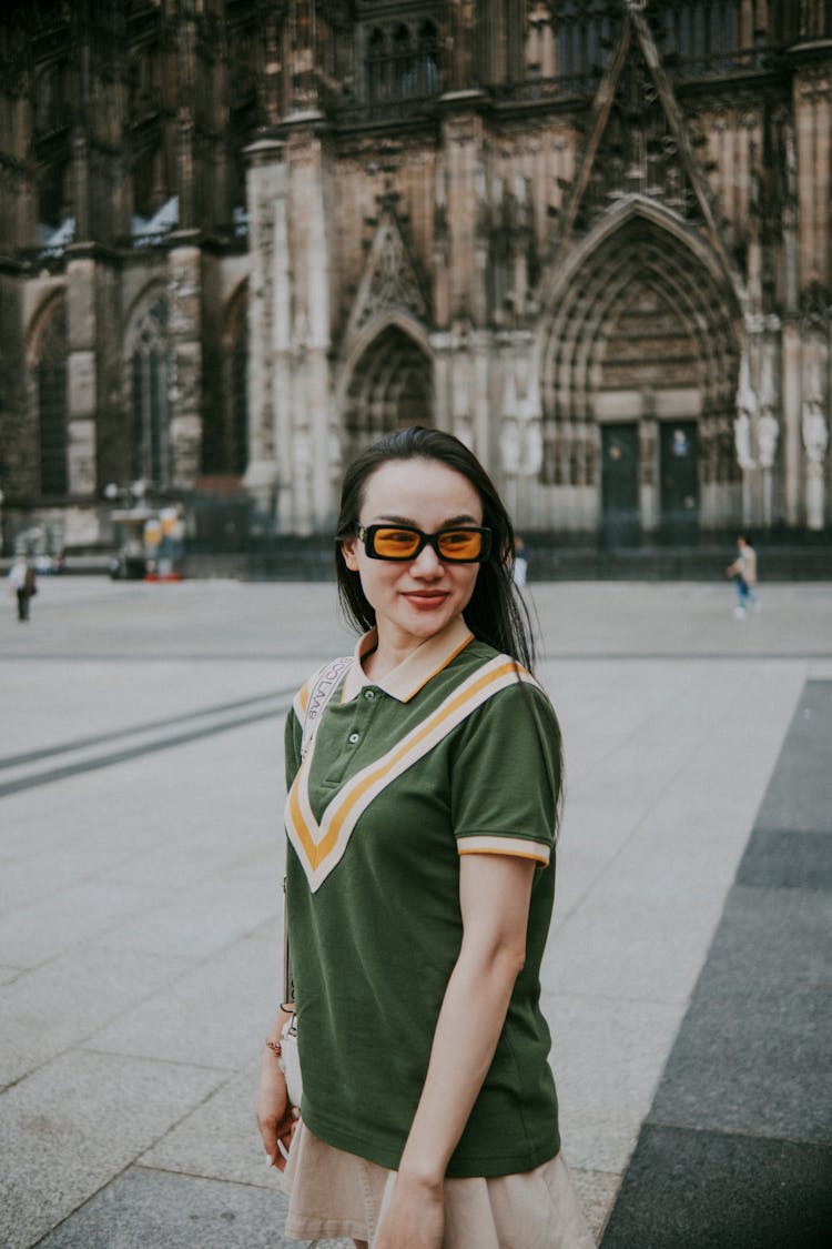 A Woman Standing In A City