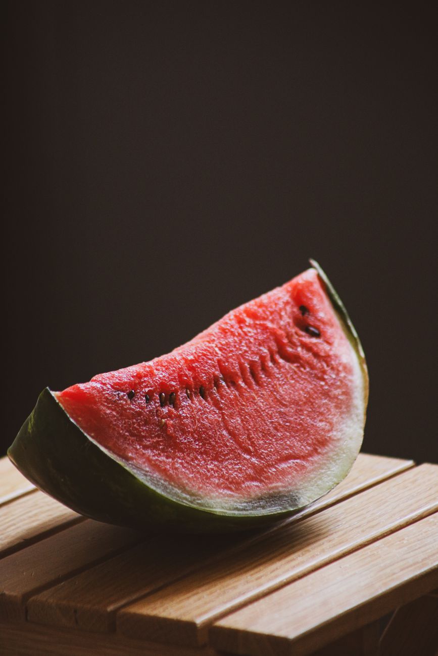 Watermelon quarter showing rind and seeds