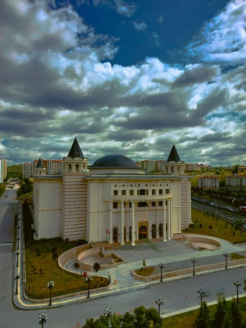 Free Stunning building exterior under a cloudy sky, showcasing modern architecture in an urban setting. Stock Photo
