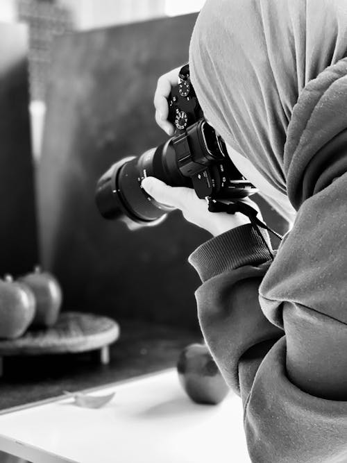 Woman Taking Photos with a Camera 