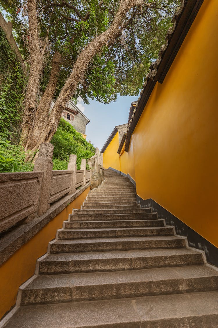 Low Angle View Of Outdoor Stone Steps And A Wall 