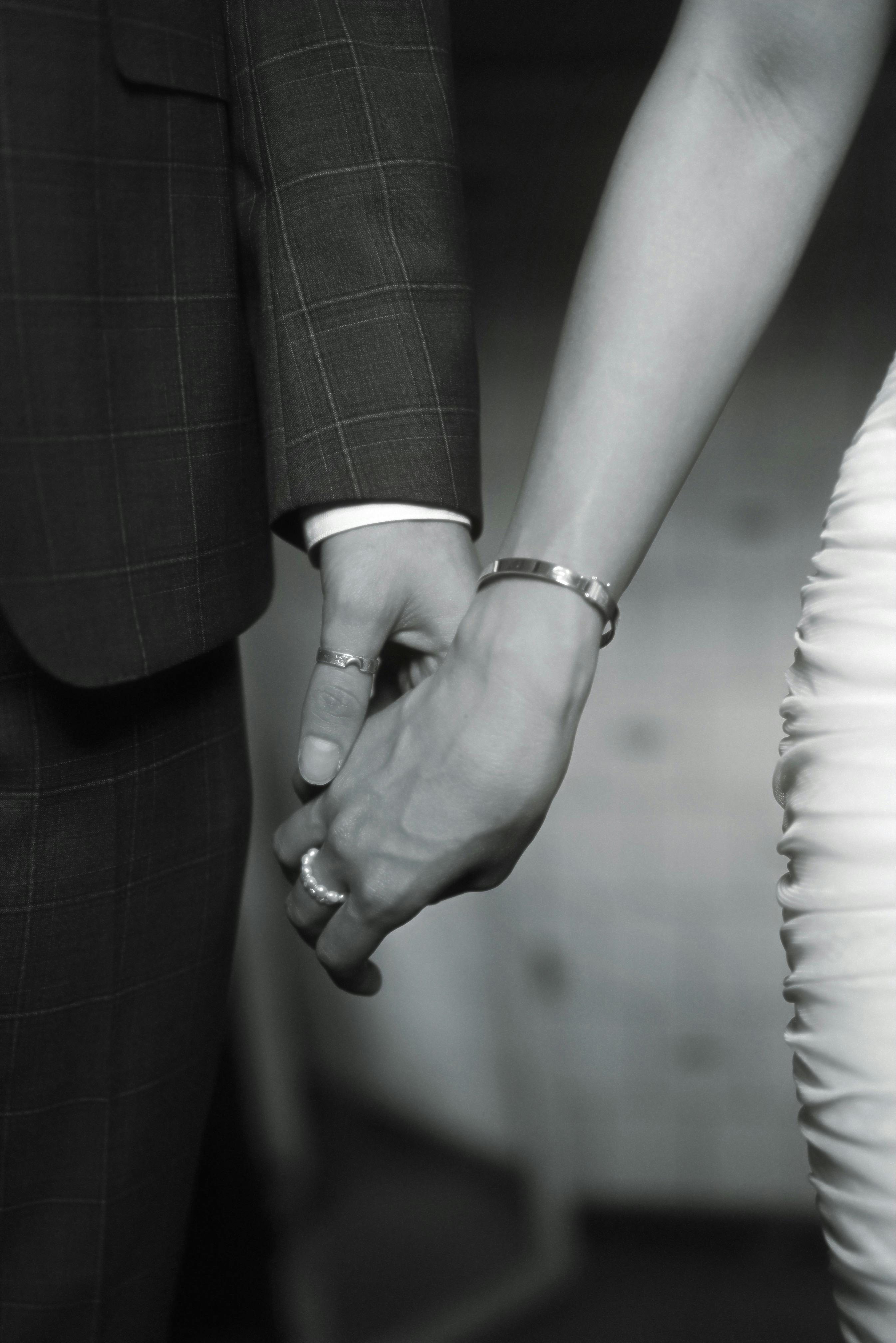 Couple Holding Hands and Standing Side by Side · Free Stock Photo
