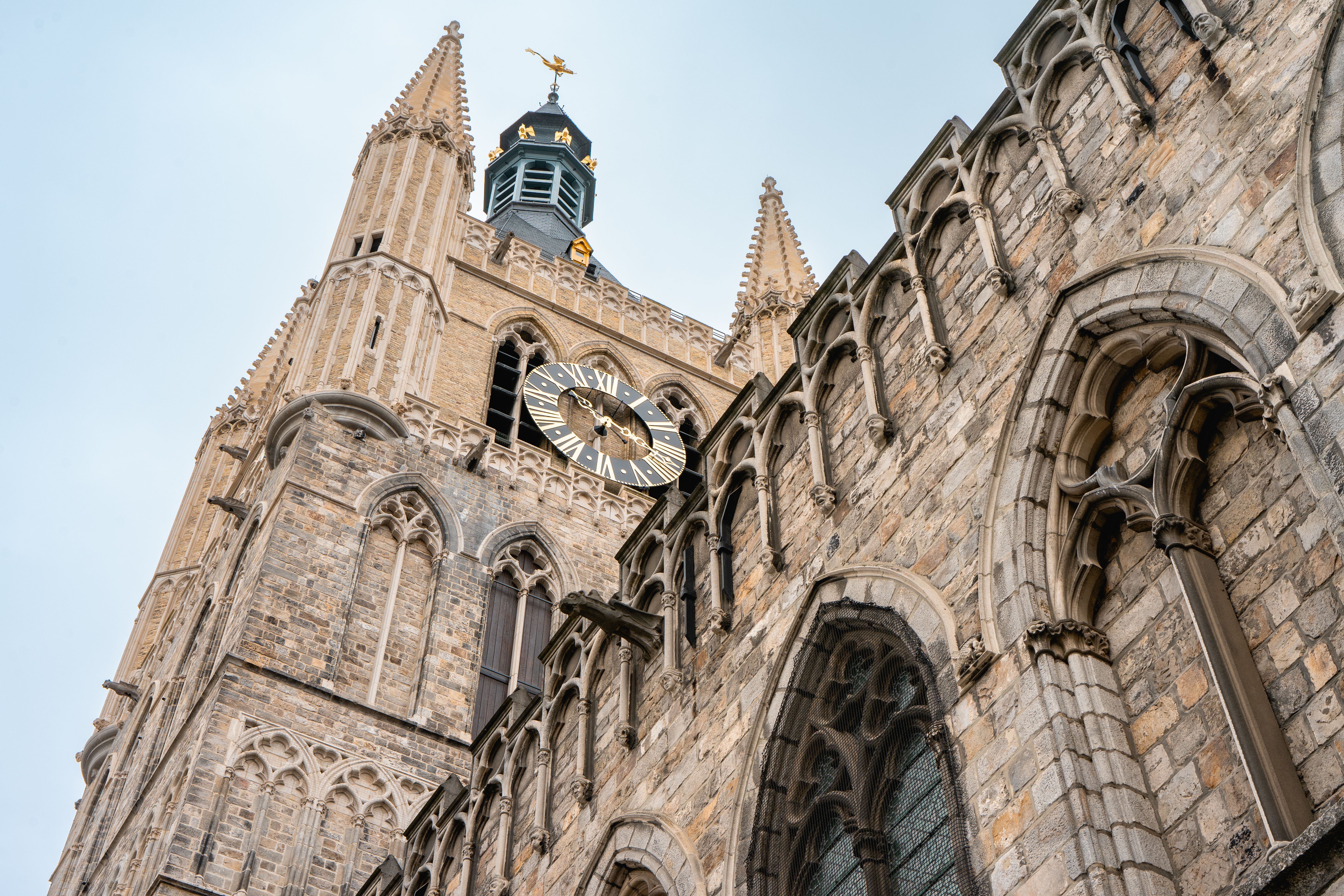 Explore the intricate Gothic design and towering spires of Saint Martin's Cathedral in Ieper, Belgium.