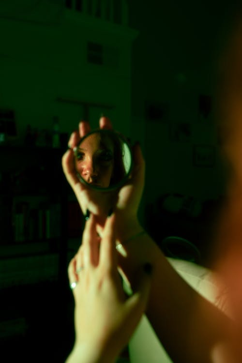 A Person Holding a Mirror