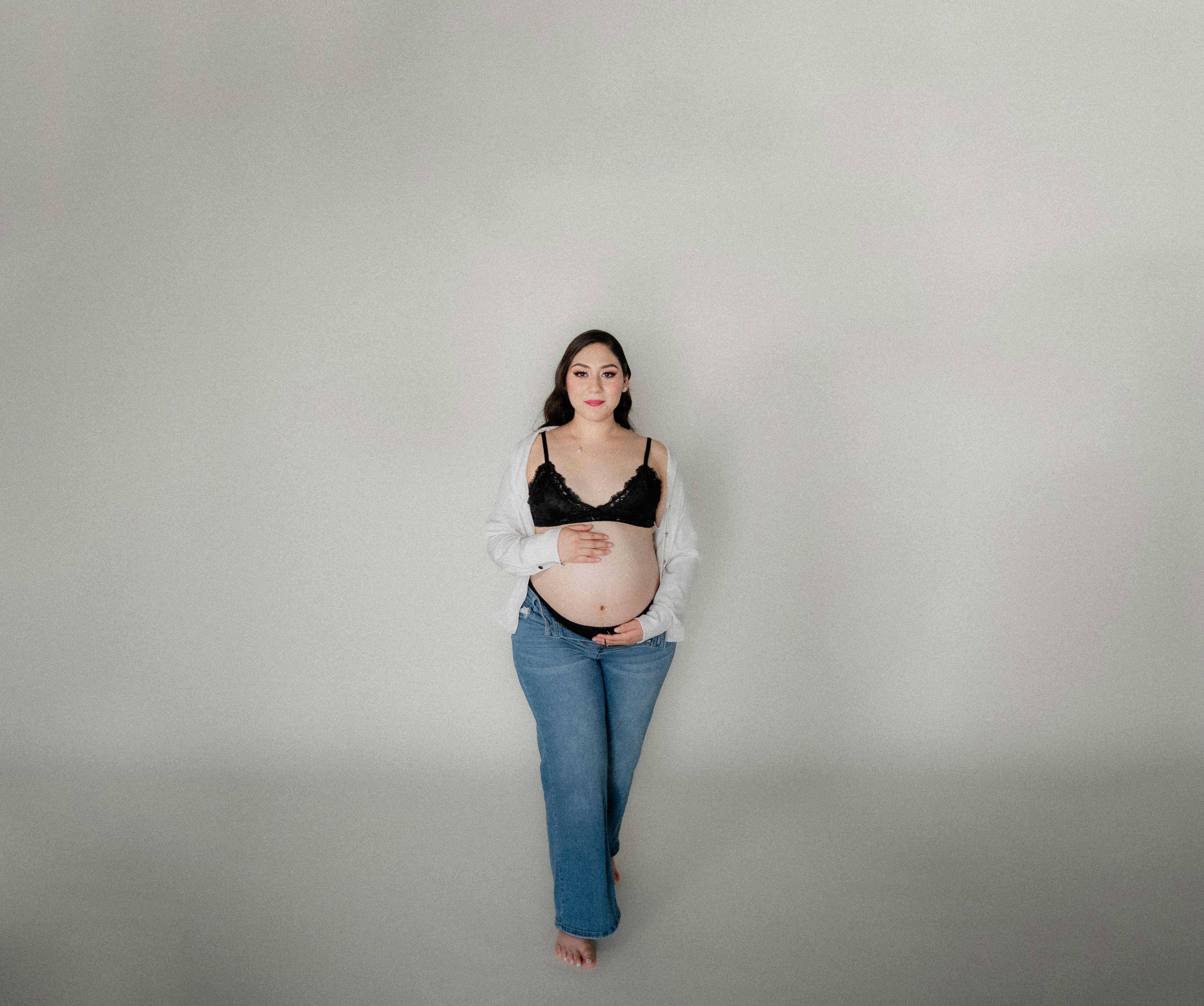 Cropped image of faceless woman touches her abdomen anticipates for baby  wears festive dress poses indoor. Women and pregnancy concept 8866921 Stock  Photo at Vecteezy