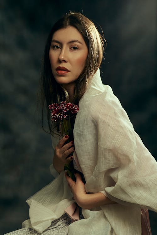 Portrait of a Woman Holding a Flower