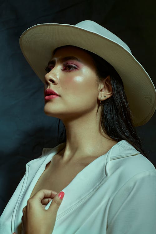 Beautiful Woman in a White Shirt and Hat 